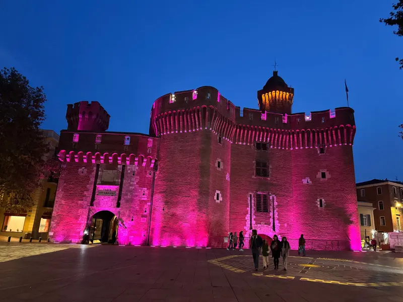 The Castillet in Perpignan lit up in pink for Octobre Rose