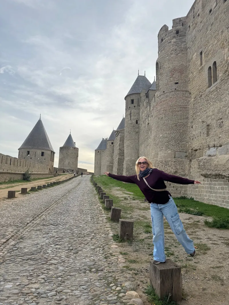 My mom posing next to the ramparts of Carcassonne