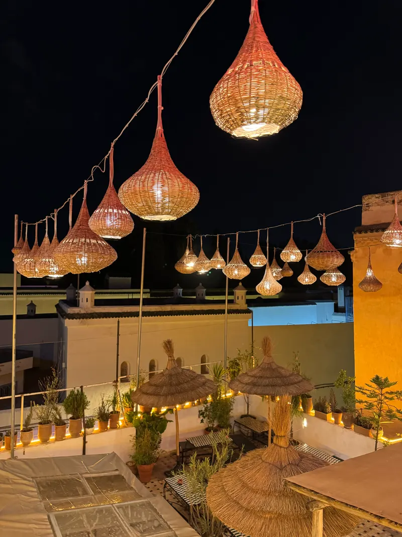Darna rooftop terrace in Fes, strung with lamps
