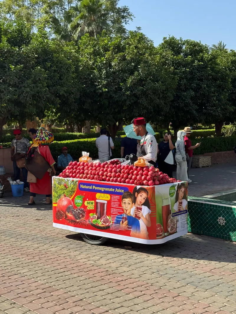 Street vendor selling fresh pomegranate juice in front of Koutoubia Mosque