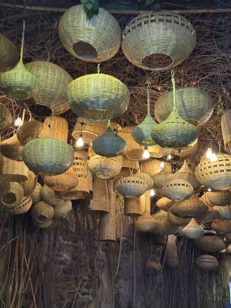 Wicker lamps hanging over a street in the Marrakech medina
