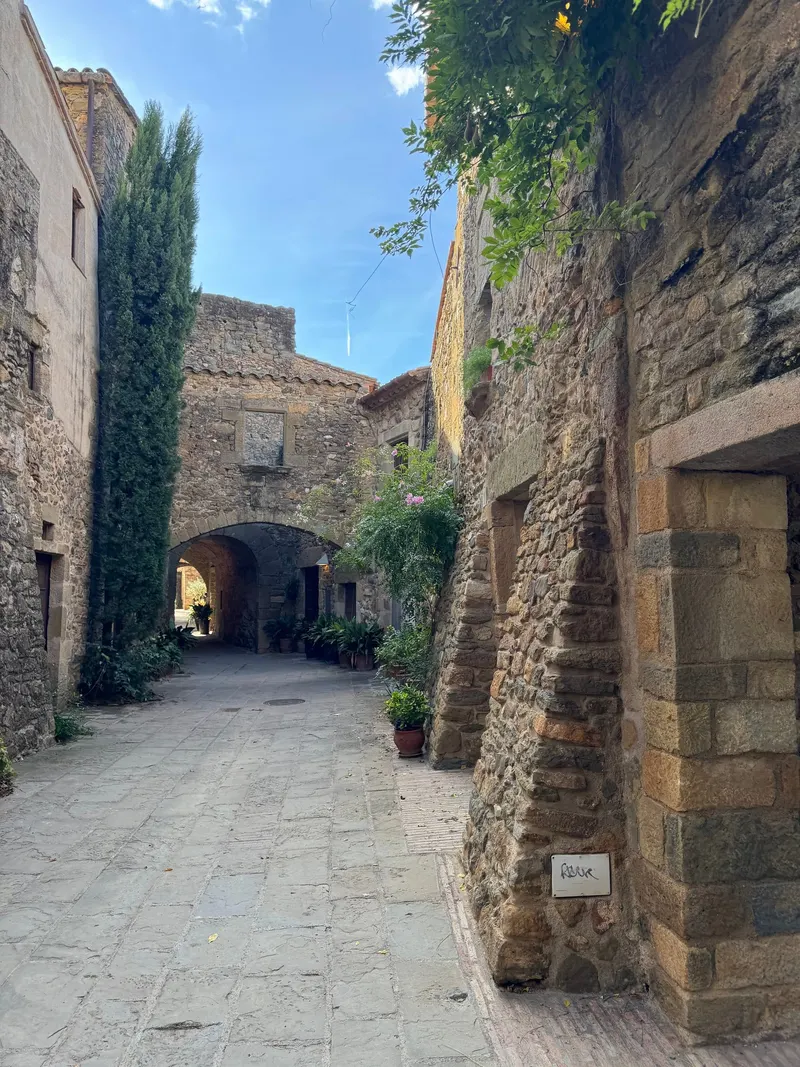 Empty stone streets in the medieval village of Monells