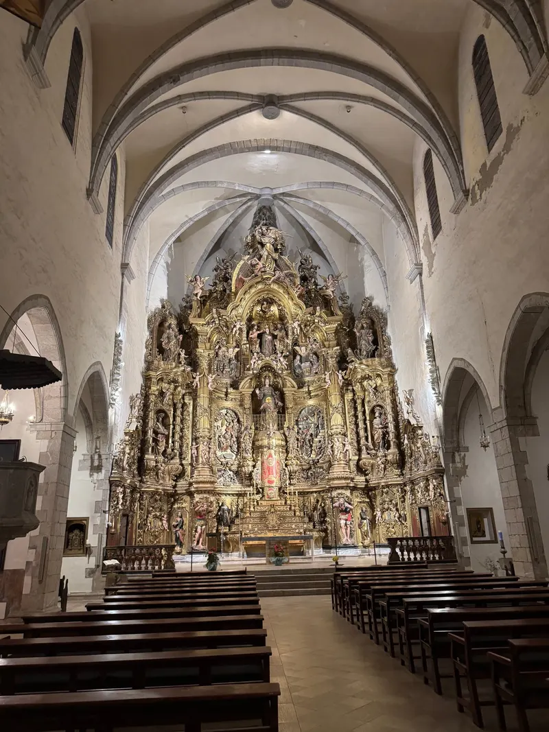 Intricate gilded altarpiece inside the church of Cadaqués