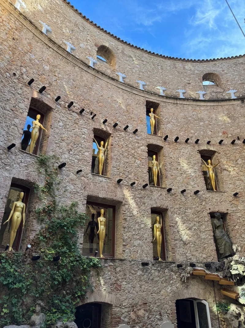 Golden mannequins hanging on the inner balconies of the Dalí Theatre-Museum