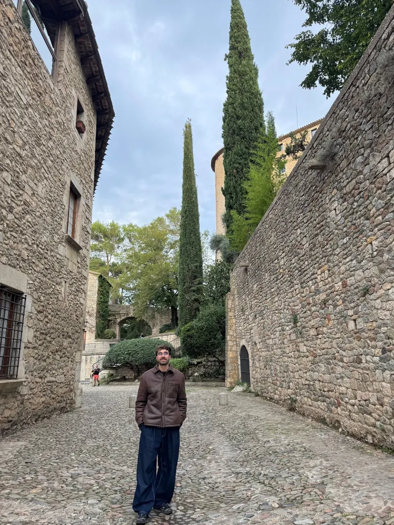 Standing on a cobblestone street in Girona's Barri Vell
