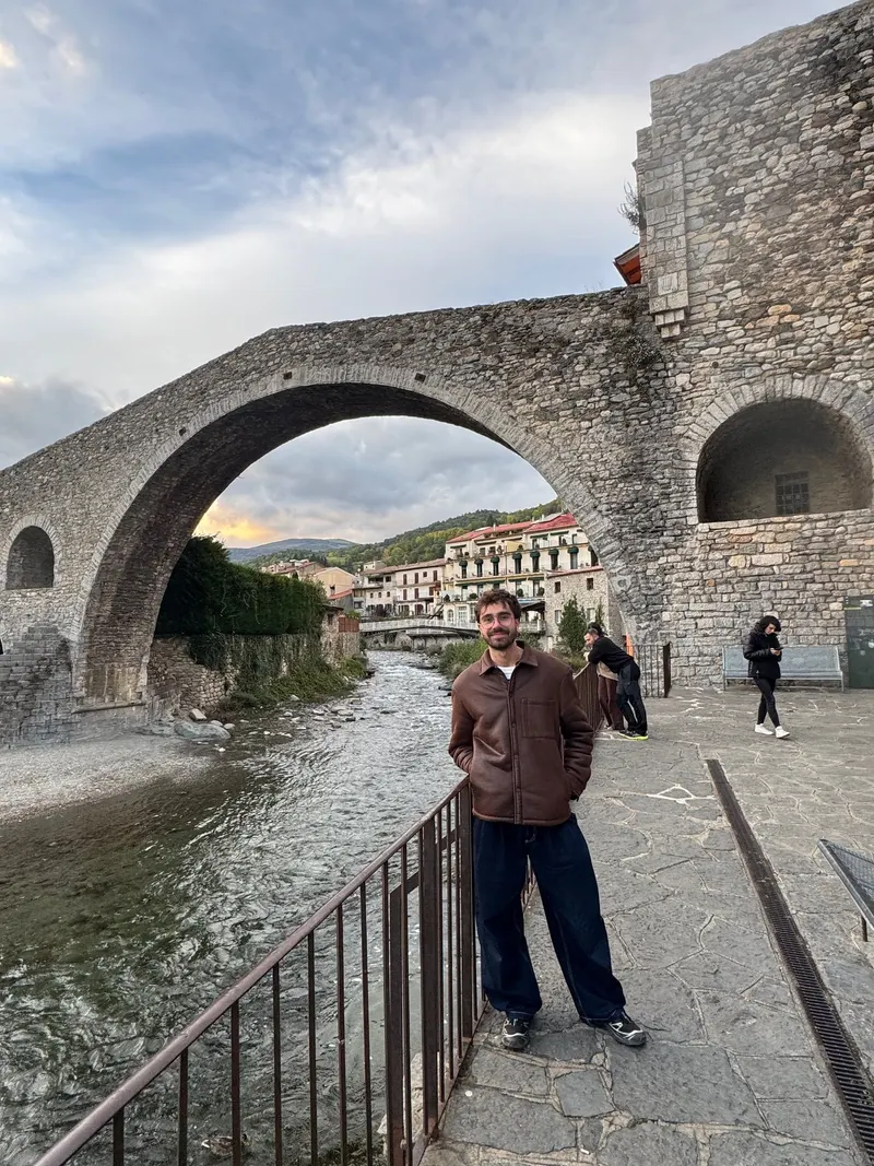 Standing with Camprodon's bridge behind during the day