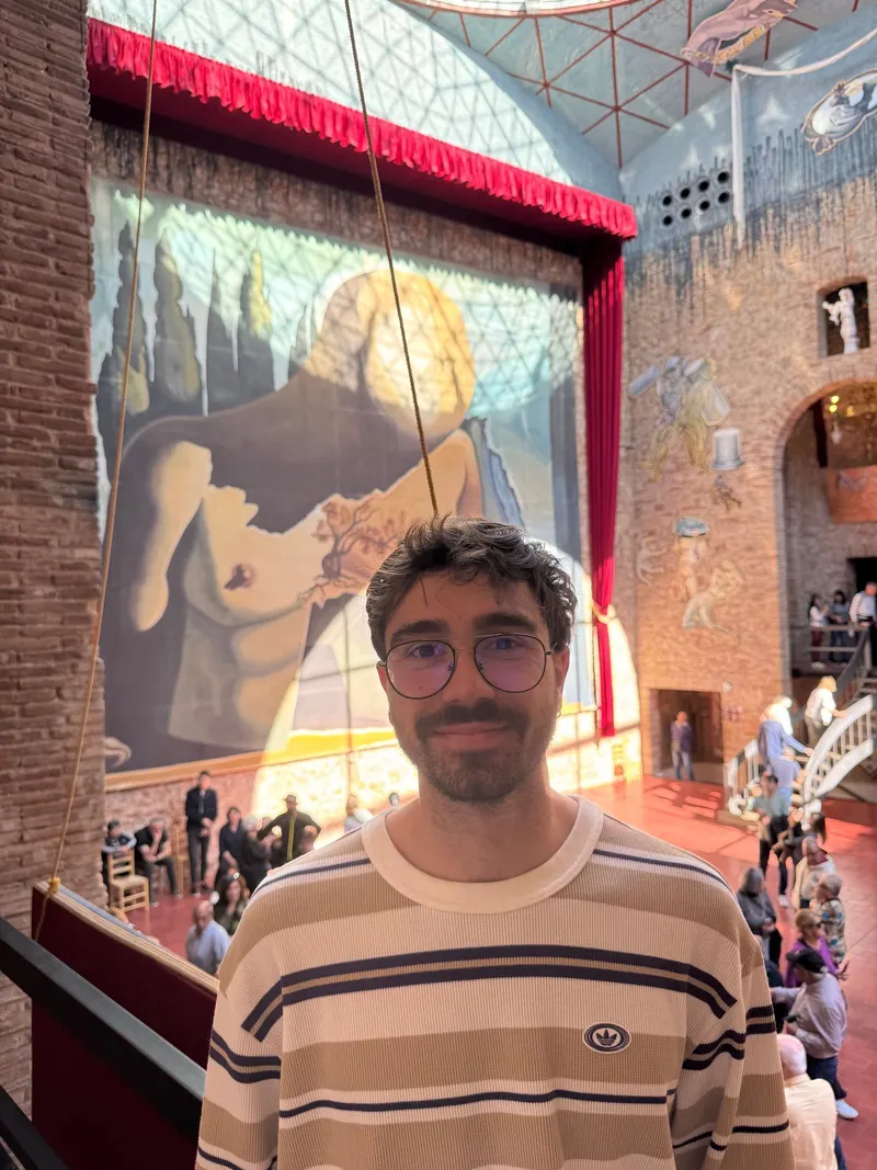 Standing in front of a painting inside the Dalí Theatre-Museum