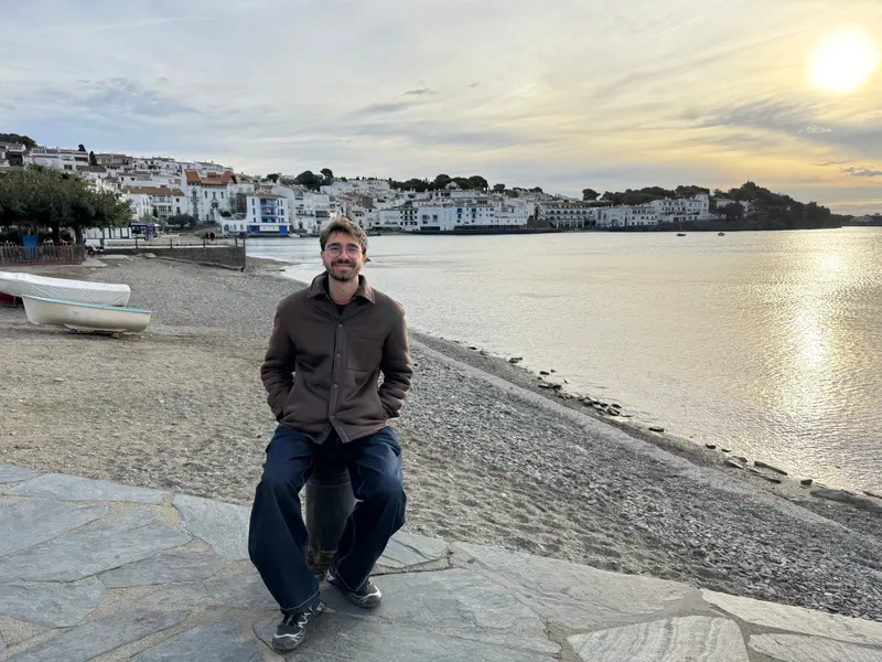 Sitting on the beach with a view of Cadaqués behind