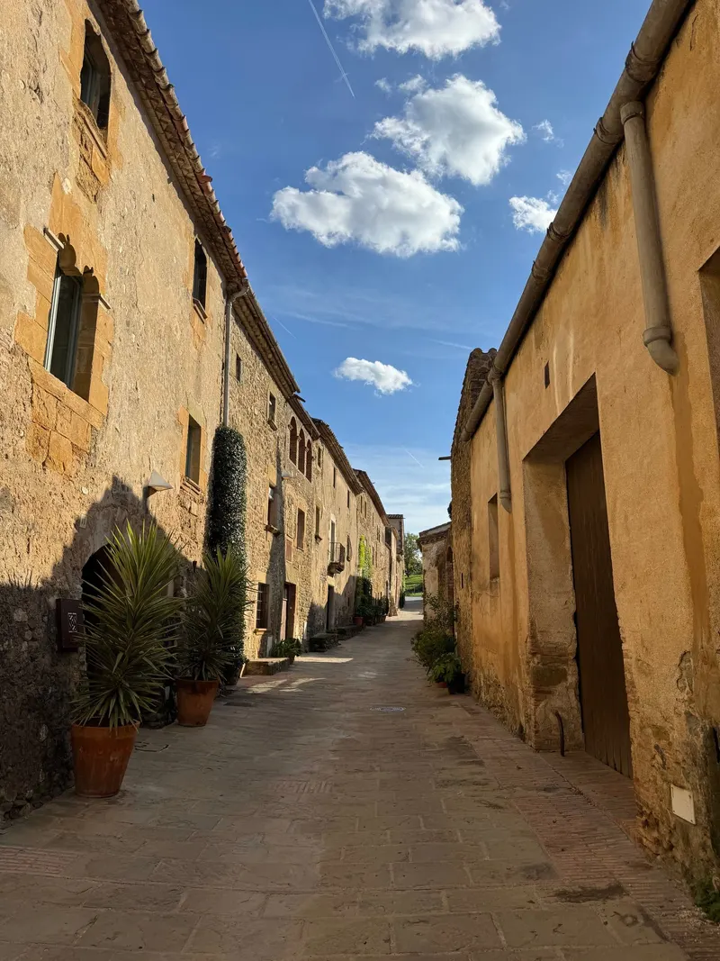 A quiet stone street in Monells, Girona province
