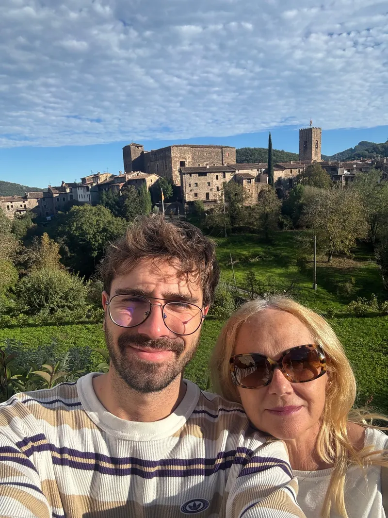 Selfie with my mom in front of the medieval town of Santa Pau