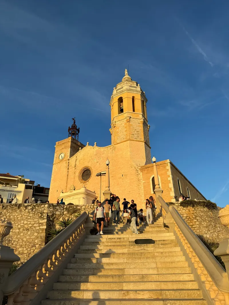 Stairs leading up to the church in Sitges at golden hour