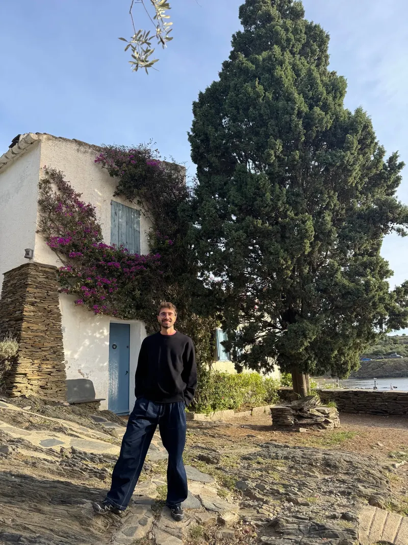 Standing in front of Dalí's house in Portlligat