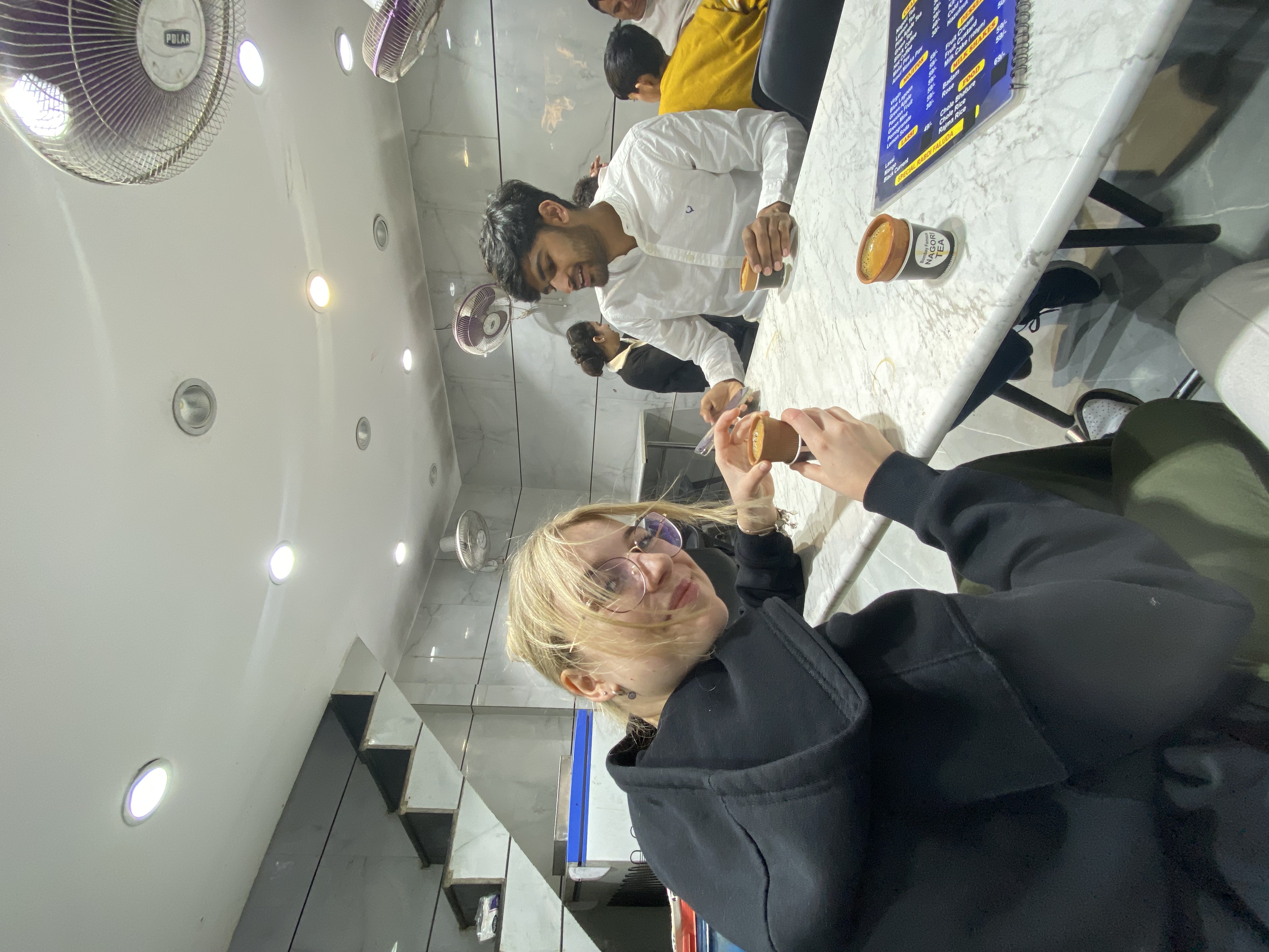 Drinking chai with our guide in New Delhi