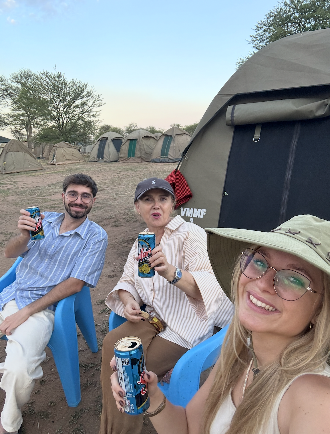 Drinking a Safari lager beer in front of our tent in Ngorongoro National Park Tanzania