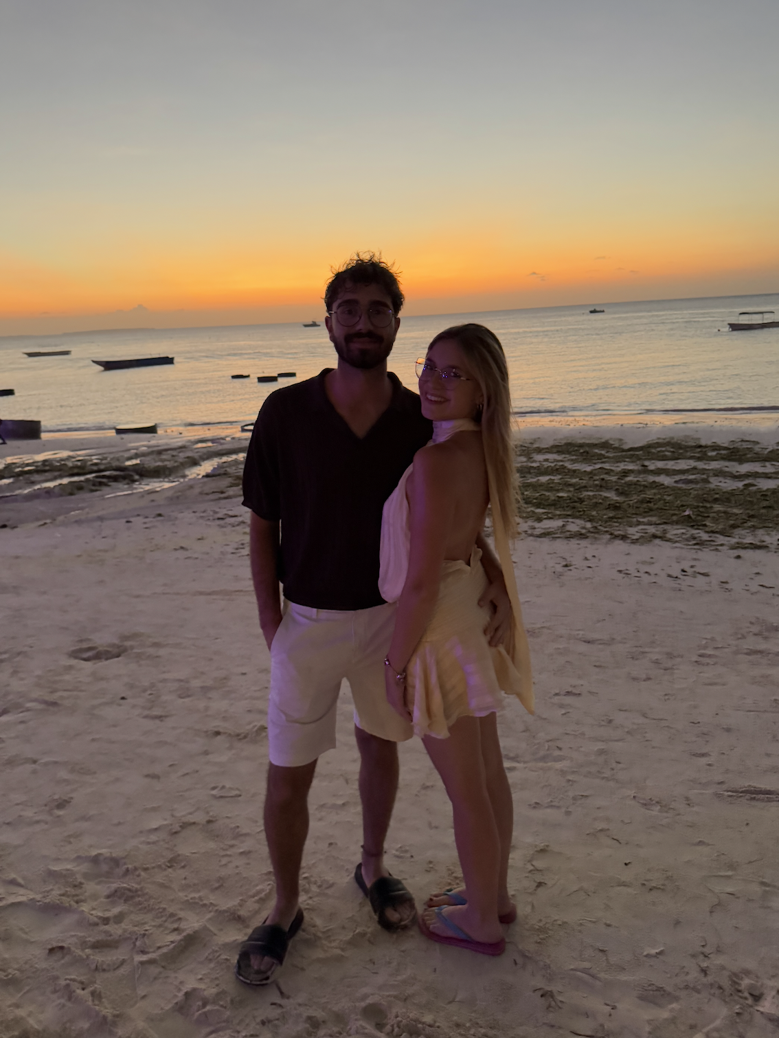 Stunning sunset over Nungwi beach in Zanzibar with turquoise water and palm trees